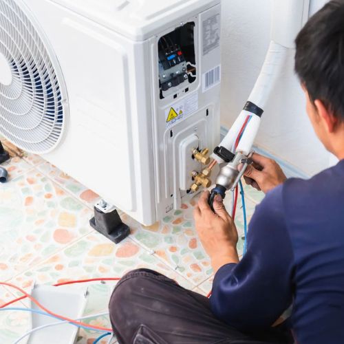 Park Side Air & Heat Repair technician servicing an HVAC system in Baldwin Park, CA